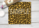 A sample piece of adhesive vinyl with a leopard animal print pattern.