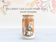 Decorative glass jar with a rocking horse design on a light wooden surface, featuring Libbey can glass wrap and UV DTF stickers text.
